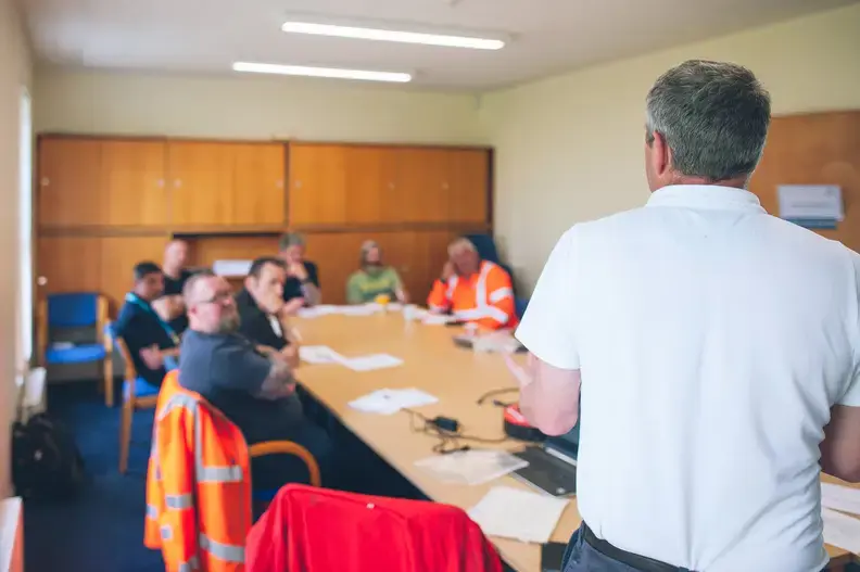 YTL employees sat at a table during a training session