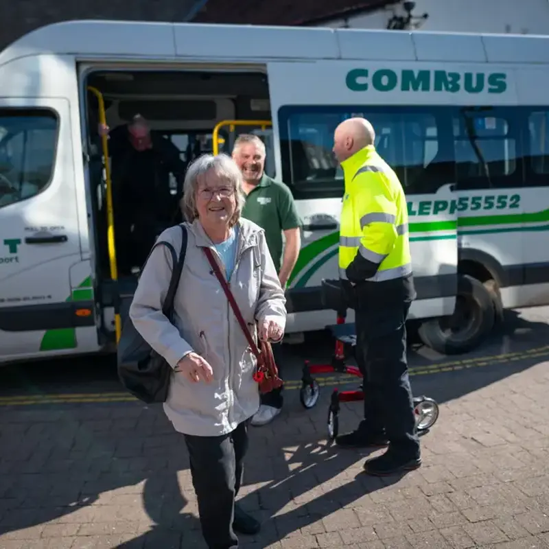 A member of the public leaving a community funded minibus service